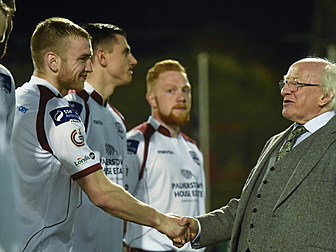 'Michael D. Higgins sat at the...